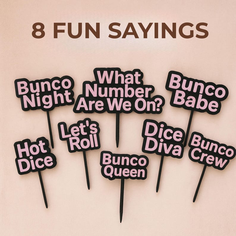 May include: A collection of eight black and pink Bunco game-themed signs. Each sign features a different phrase, including "Bunco Night," "What Number Are We On?," and "Bunco Babe." The words are in pink with a black border.