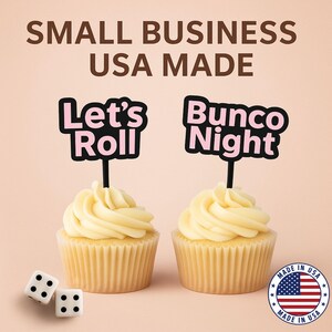 May include: Two cupcakes with light yellow frosting and black and pink toppers that read "Let's Roll" and "Bunco Night." Two dice and a "Made in USA" sticker are also visible. The text "SMALL BUSINESS USA MADE" is at the top.