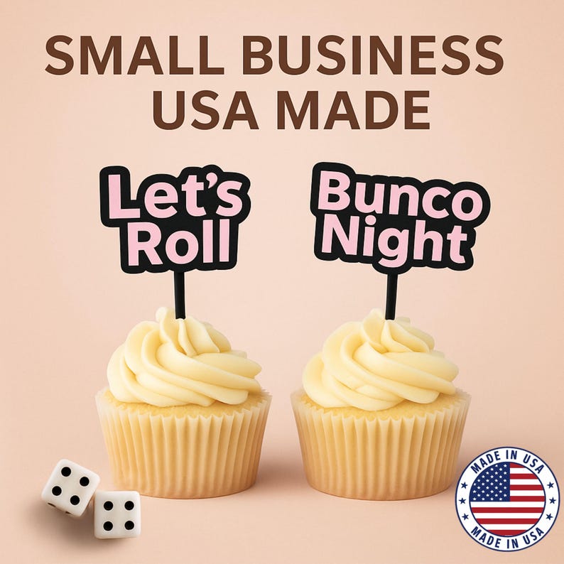 May include: Two cupcakes with light yellow frosting and black and pink toppers that read "Let's Roll" and "Bunco Night." Two dice and a "Made in USA" sticker are also visible. The text "SMALL BUSINESS USA MADE" is at the top.