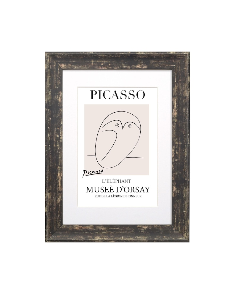 May include: A framed print of a black and white line drawing of an elephant by Pablo Picasso. The print is titled "L'Elephant" and includes the text "Mus&eacute;e d'Orsay" and "Rue de la L&eacute;gion d'Honneur".