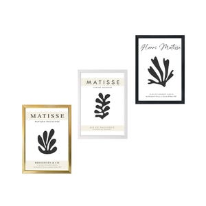 May include: Three framed prints of Matisse's paper cutouts. The top print is black and white with the text "Henri Matisse" and a black cutout of a plant. The middle print is white with a black cutout of a plant and the text "MATISSE PAPIERS DECOUPES AIR EN PROVENCE EDITION DE FOURNIER". The bottom print is gold with a black cutout of a plant and the text "MATISSE PAPIERS DECOUPES BERGGRUEN & CIE".