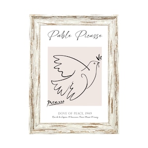 May include: A framed print of a black and white line drawing of a dove with an olive branch in its beak. The print is titled "Dove of Peace, 1949" and is signed "Picasso".