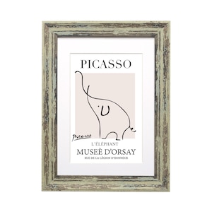 May include: A framed print of a line drawing of an elephant by Pablo Picasso. The print is titled "L'&eacute;l&eacute;phant" and includes the text "Mus&eacute;e d'Orsay" and "Rue de la L&eacute;gion d'honneur".
