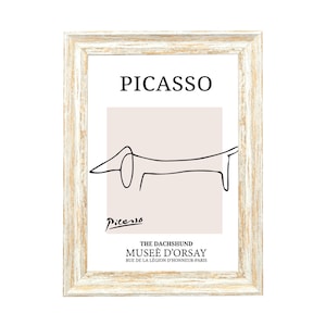 May include: A framed print of a black and white line drawing of a dachshund by Pablo Picasso. The print is titled "The Dachshund Mus&eacute;e d'Orsay" and includes the museum's address: Rue de la L&eacute;gion d'Honneur-Paris.