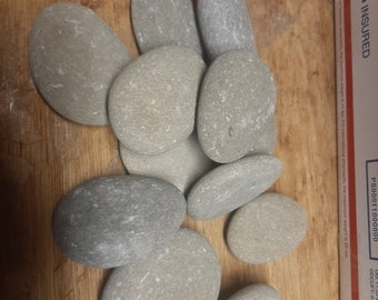 100  2 - 2 1/2" odd shaped smooth stones