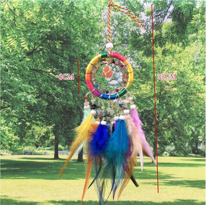 May include: A rainbow dream catcher with feathers and beads. The dream catcher is 6 inches in diameter and 14 inches long.