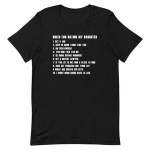 May include: Black t-shirt with white text that reads "Rules for Dating My Daughter" followed by a numbered list of rules.