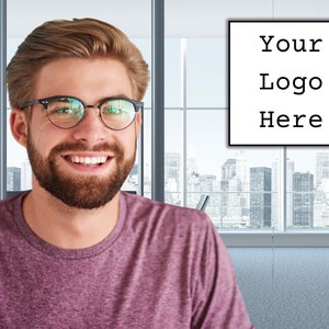 May include: A man wearing glasses and a maroon shirt smiles in an office setting. A sign on the wall reads "Your Logo Here". The background features a cityscape visible through large windows.