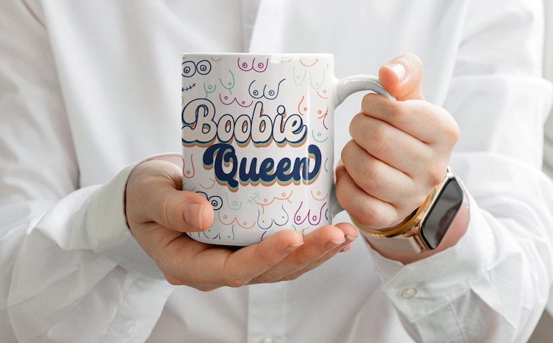 Funny mug for breastfeeding moms, lactation consultants that says “Bobbie Queen” & features lots of different cartoon breasts in tasteful retro design
