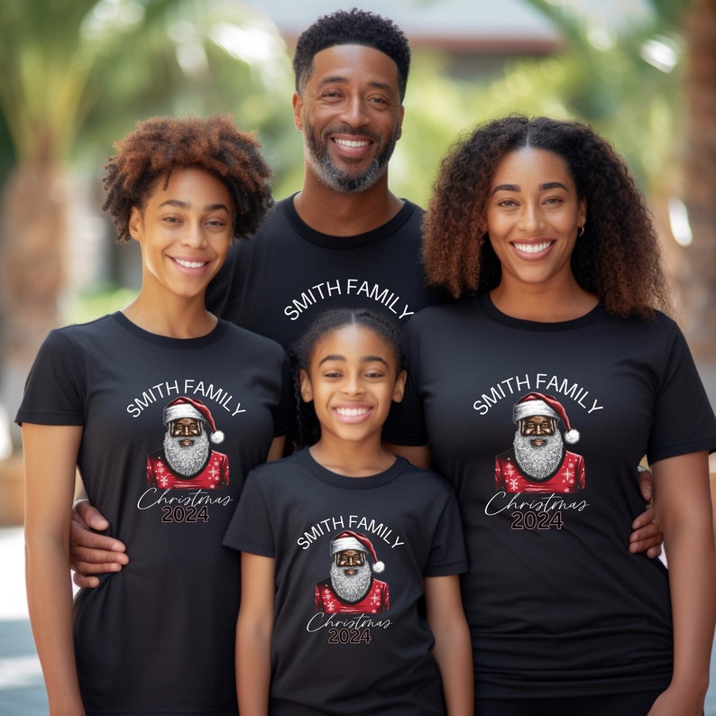 May include: A family of four wearing black t-shirts with a black Santa Claus graphic and the text "SMITH FAMILY Christmas 2024".