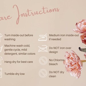 May include: Care instructions for a garment. The instructions include washing, drying, ironing, and bleaching. The instructions are written in white text on a light pink background with a floral design.