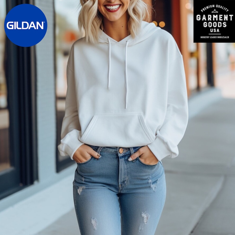 May include: A white hooded sweatshirt with a kangaroo pocket and a drawstring hood. The sweatshirt is worn by a person with light blue jeans.