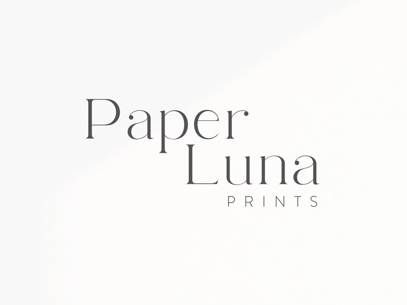 May include: The words "Paper Luna Prints" are displayed in a minimalist, elegant font. The text is in a dark gray color against a white background. The design is simple and clean, suitable for branding or a logo.