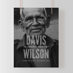 May include: Black and white memorial poster featuring a portrait of an elderly person. The poster includes the names "Davis Wilson" and the text "In Loving Memory" along with the dates "February 1994 - December 2024".
