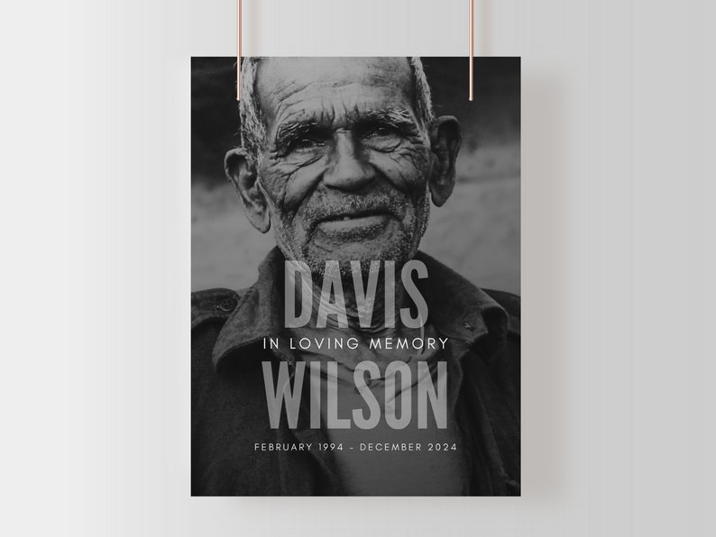 May include: Black and white memorial poster featuring a portrait of an elderly person. The poster includes the names "Davis Wilson" and the text "In Loving Memory" along with the dates "February 1994 - December 2024".