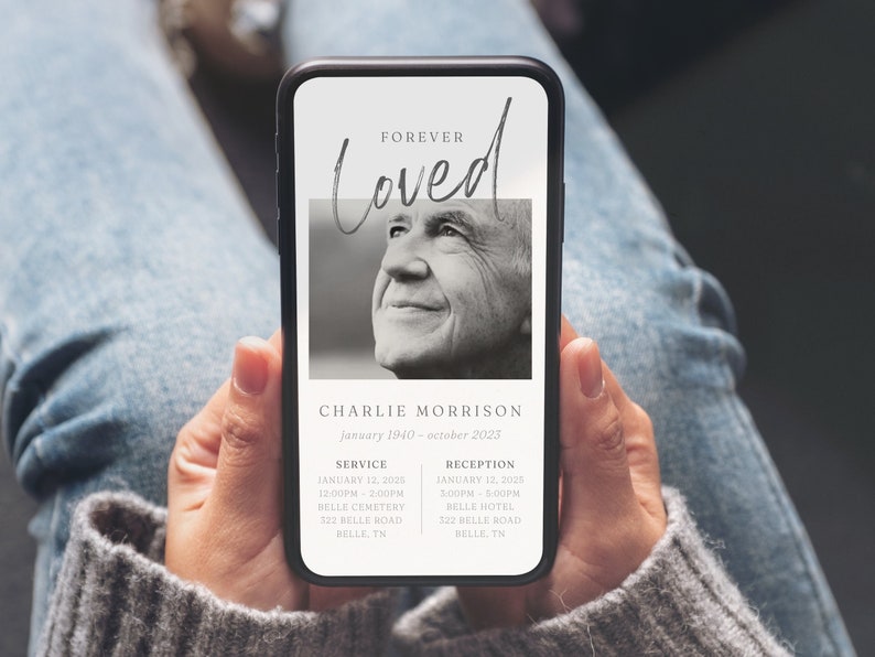 May include: A black and white photo of a man on a smartphone screen with the text "FOREVER Loved" above the photo. The text "CHARLIE MORRISON January 1940 - october 2023" is below the photo. The text "SERVICE JANUARY 12, 2025 12:00PM - 2:00PM BELLE CEMETERY 322 BELLE ROAD BELLE, TN" is on the left side of the screen. The text "RECEPTION JANUARY 12, 2028 3:00PM - 5:00PM BELLE HOTEL 322 BELLE ROAD HELLE, IN" is on the right side of the screen.