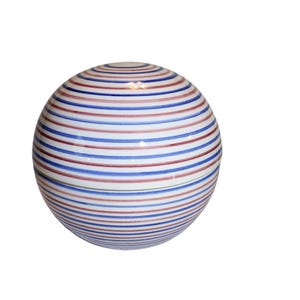 May include: A spherical ceramic container with a lid, featuring a white base and horizontal stripes in alternating shades of red and blue. The stripes encircle the entire surface of the container, creating a visually appealing pattern. The container is likely used for storage or decorative purposes.