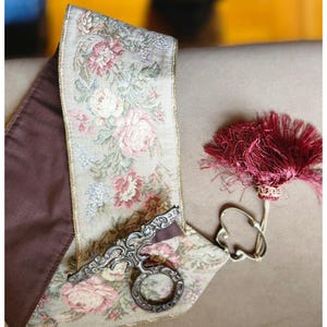 May include: A set of three ceramic mugs with a speckled, matte finish. Each mug features a different color: light blue, cream, and gray. The mugs have a simple, modern design and a comfortable handle.