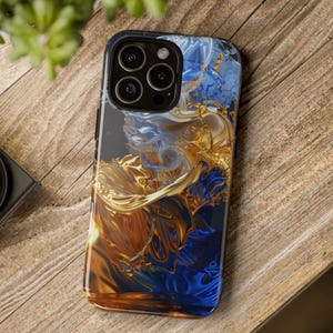 May include: A phone case with a design of swirling blue and gold abstract shapes. The case has a black border and a camera lens cutout.