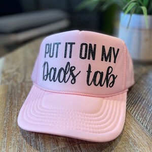 'PUT IT ON MY DAD'S TAB' Trucker Hat main image 1