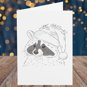 Carte de Noël raton laveur, carte de voeux Père Noël Schlurpi - carte exclusive illustrée à la main à l'aquarelle et au crayon pour les amateurs de raton laveur, papier mat
