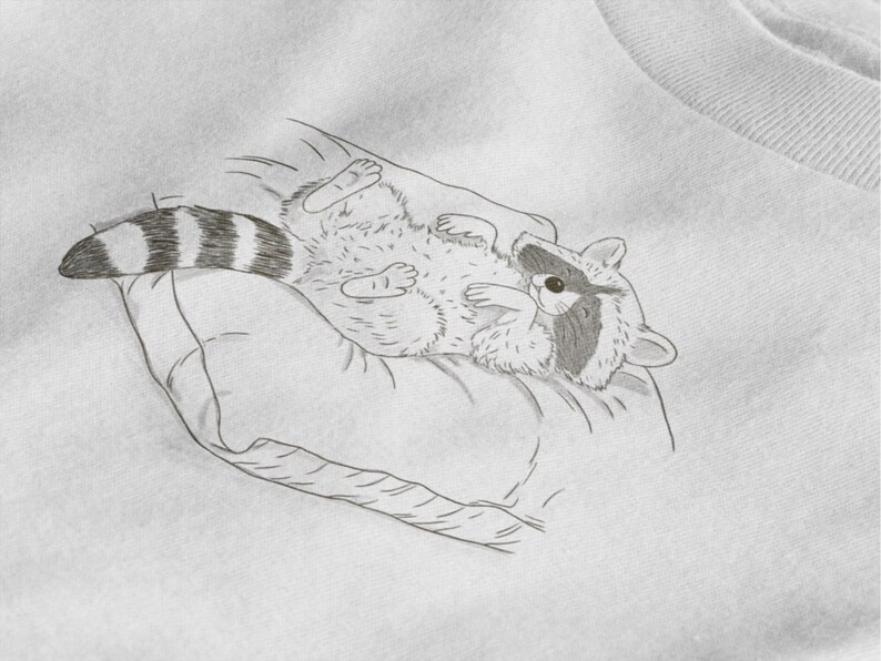 Schlurpi the Raccoon T-Shirt – Cozy Nap | Women’s Organic Cotton Shirt | Sketch-Style Raccoon Illustration