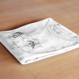 Schlurpi the Sleeping Raccoon – Unisex T-Shirt | Sustainable Cotton Shirt with Hand-Drawn Illustration