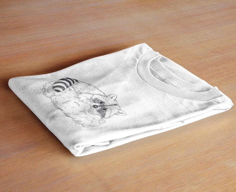 Schlurpi the Sleeping Raccoon – Unisex T-Shirt | Sustainable Cotton Shirt with Hand-Drawn Illustration