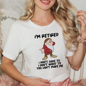 May include: White t-shirt with a cartoon image of a grumpy dwarf and the text "I'm Retired I don't have to I don't want to You can't make me"