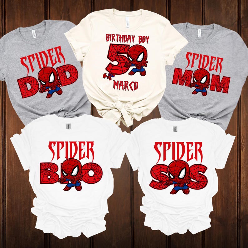 May include: Five t-shirts with a Spider-Man theme. The shirts are grey and white, with red text and a Spider-Man graphic. The text includes "Spider Dad", "Spider Mom", "Spider Bro", "Spider Sis", and "Birthday Boy 5 Marco".