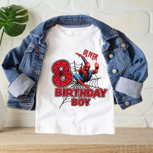 May include: White t-shirt with a red number 8, a Spiderman graphic, and the text "Oliver Birthday Boy".