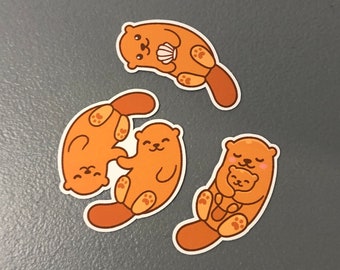 3 otterstickers, stickerpakket met otters, otters die elkaars hand vasthouden, ottercadeau, otterfeestartikel, sticker voor drinkbeker, sticker voor laptop, sticker voor telefoonhoesje