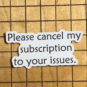 May include: White sticker with black text that reads "Please cancel my subscription to your issues."