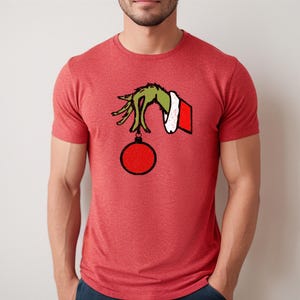 Grinch Holding Ornament Shirt | Funny Grinch T-shirts | Christmas Grinch Shirt | Christmas Movie Grinch Shirt | Funny Christmas Apparel