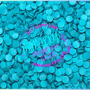 May include: A close-up shot of a pile of turquoise-colored, circular, flat-topped objects. The objects are scattered and overlapping. A circular graphic in the center reads "DIY SUPPLIER maxxy THANK YOU FOR YOUR PREFERENCE momazzzy etsy.com".