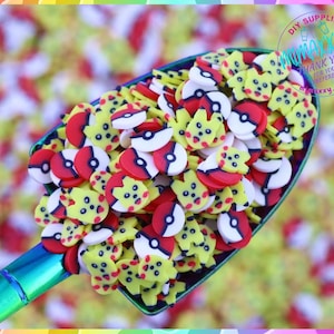 May include: A scoop filled with colorful polymer clay charms. The charms are shaped like Poké Balls and Pikachu. The charms are red, yellow, white, and black.