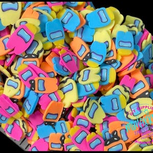 May include: A large pile of colorful, flat, plastic shapes resembling the characters from the video game Among Us. The shapes are in various colors, including yellow, blue, pink, orange, and black.