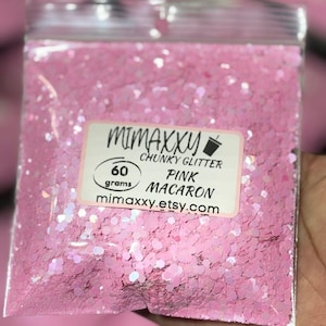 May include: A resealable bag of pink chunky glitter labeled "Mimaxxu Chunky Glitter Pink Macaron 60 grams mimaxxu.etsy.com"