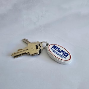 JDM Style Keychain – Car Enthusiast Gift Oval Keyring, Inspired by Heritage NISMO Logos