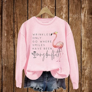 Wrinkles Only Go Where Smiles Have Been Sweatshirt, Flamingo Jimmy Buffett Memorial T-Shirt, Jimmy Buffett Long-Sleeve