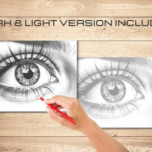 May include: Two black and white pencil drawings of a human eye. The drawing on the left is darker than the drawing on the right. A hand is holding a red pencil and is about to draw on the left drawing.