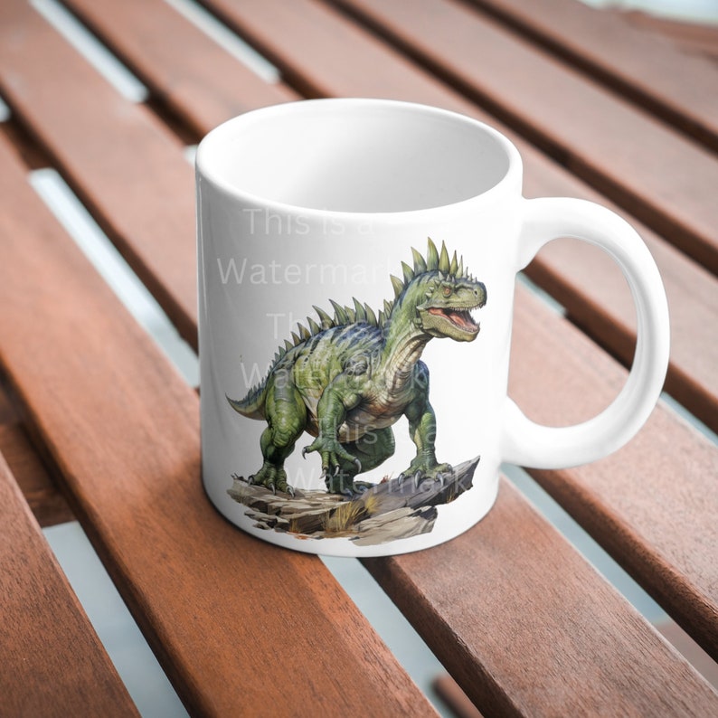 May include: White ceramic mug with a green dinosaur illustration. The dinosaur is standing on rocks and has a spiky back. The text "This is a Watermark" is visible on the mug.