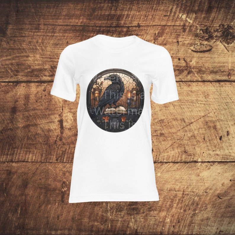 May include: White t-shirt with a circular graphic of a black raven perched on a book with candles and roses. The text "This is a Waste of Time This is"