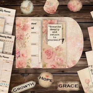 May include: A collection of stationery items with a vintage aesthetic, including planners, journals, and decorative elements. The items feature floral patterns, inspirational quotes, and the words "Growth", "Hope", and "Grace". The color palette is soft, with beige and pink tones.