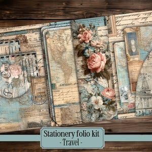 May include: A stationery folio kit with a travel theme. The kit features a collage of vintage maps, postcards, and floral accents in shades of blue, beige, and pink. The text "Stationery folio kit - Travel" is visible.