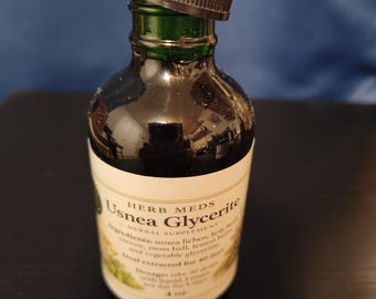 May include: A dark green glass bottle with a black dropper cap containing Herb Meds Usnea Glycerite herbal supplement. The white label lists ingredients including usnea lichen, holy basil, yarrow, moss ball, lemon balm, and vegetable glycerine, with a 4 oz volume.