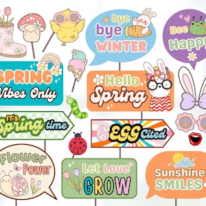 May include: A set of 12 spring-themed photo booth props featuring colorful illustrations of bunnies, flowers, rainbows, and more. The props include phrases like "Spring Vibes Only", "Hello Spring", and "Egg-cited".