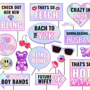 May include: A set of 12 colourful photo booth props with a Y2K theme. The props feature phrases like "Check out her new bling", "That's so fetch", "Crazy in love", "Back to the Y2K", "Downloading... Husband", "I the 2000s", "Bling Bling", "Love Boy Bands", "Future wifey 2K", and "That's so hot".