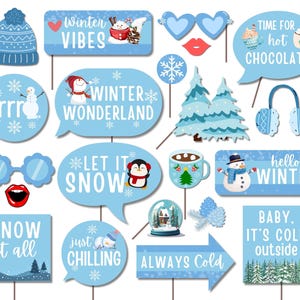 May include: A set of 14 winter-themed photo booth props with blue and white colors. The props include a snowman, penguin, snowflakes, a winter hat, a mug of hot chocolate, and various winter-themed phrases like "Let it Snow" and "Winter Wonderland".