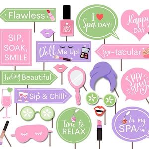 May include: A selection of spa-themed photo booth props in pink, green, and purple. Props include signs with text such as "Flawless," "Sip, Soak, Smile," and "Spa Day." Other props are a nail polish bottle, lipstick, and a sleep mask.